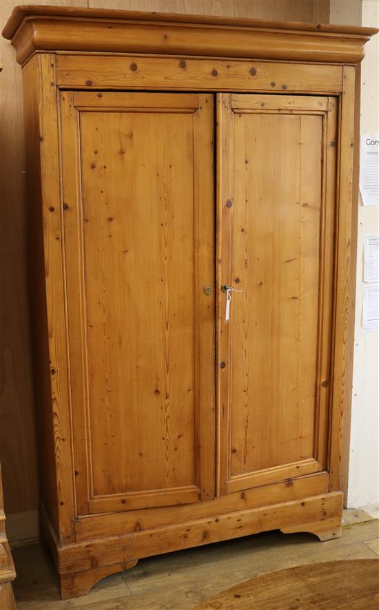 A Victorian stripped pine 2 door cupboard W.134cm